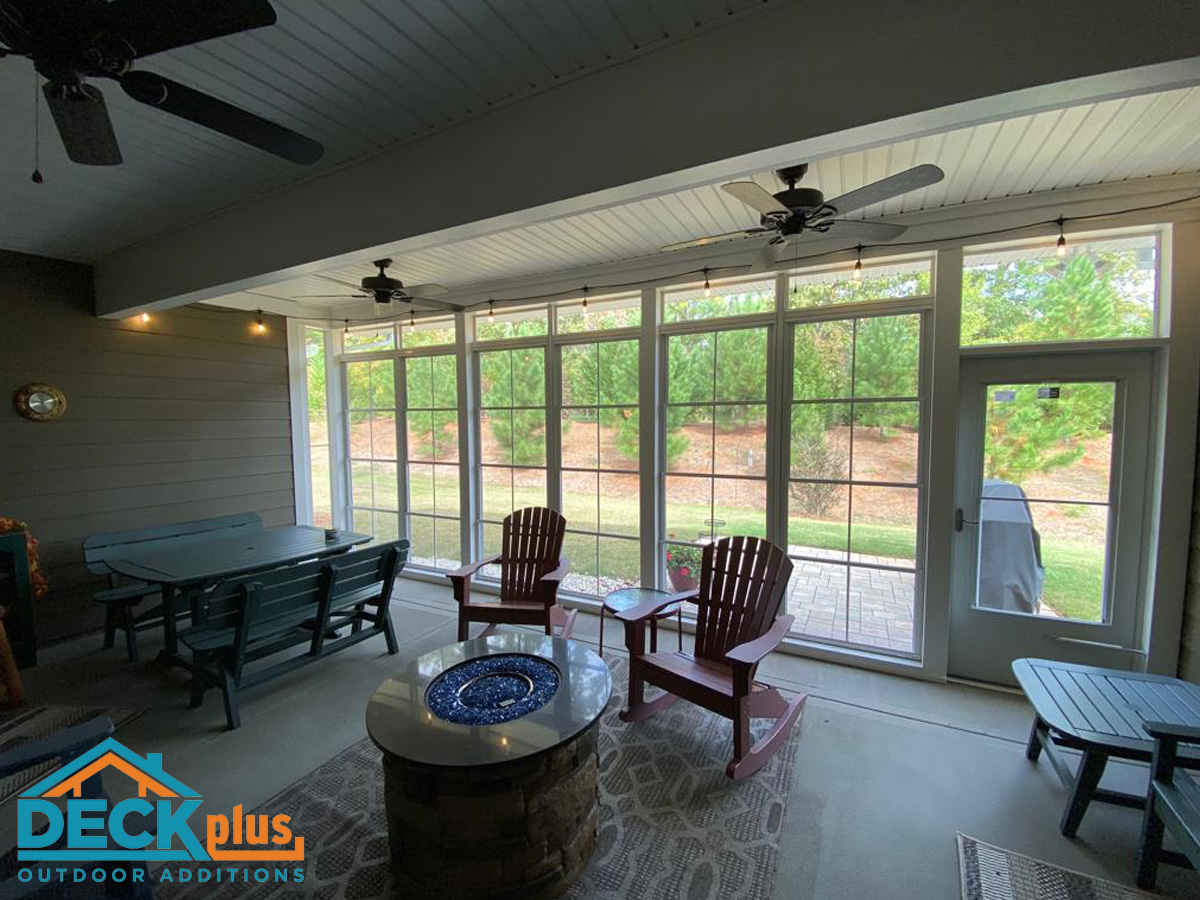 Three-season room with concrete floors and a gas fire pit