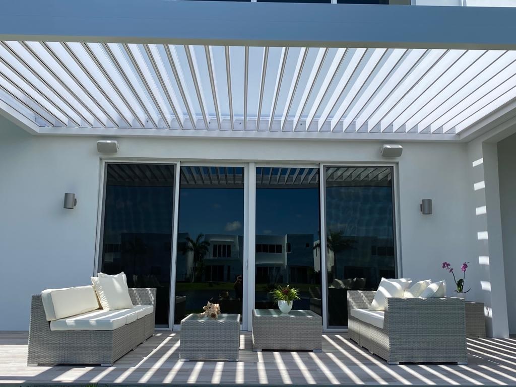 Back patio with a white pergola