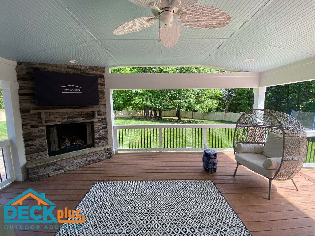 custom covered porch with outdoor fireplace