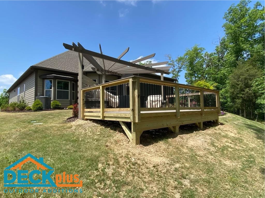 freestanding backyard deck with pergola, hardscape accents and privacy screen