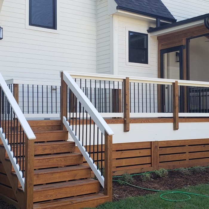 new deck on the back of a white home