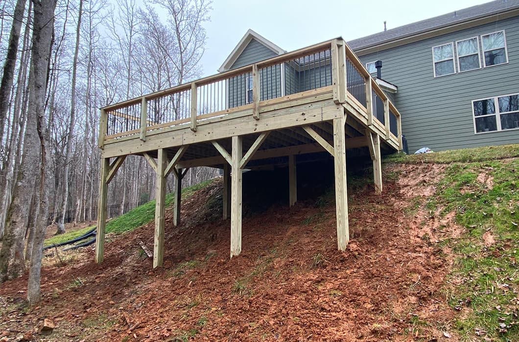A wooden deck built on a hill