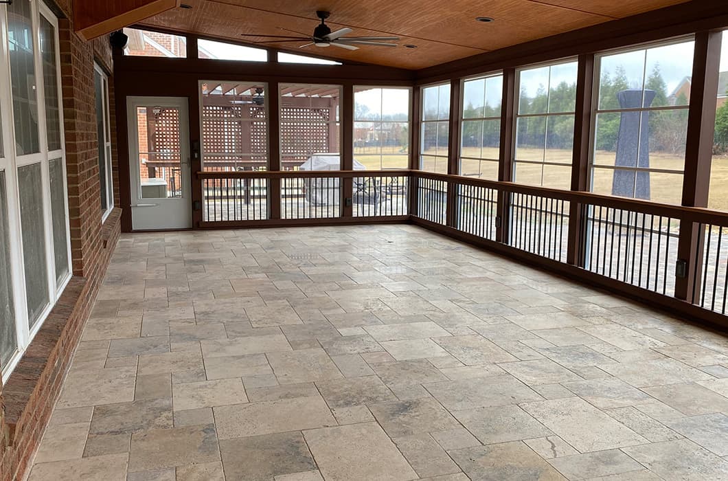 A three-season room with stone flooring